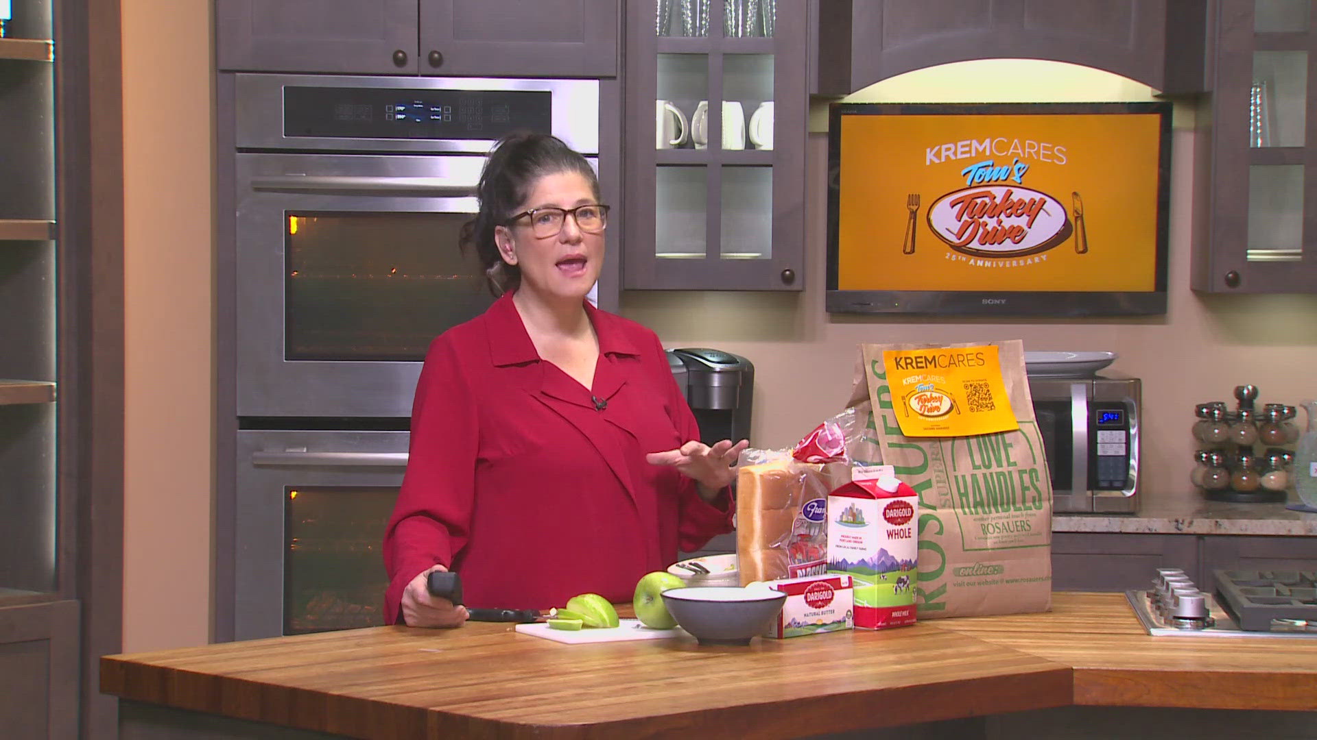 Laura starts making bread pudding with the ingredients given out in Tom's Turkey Drive bags. 