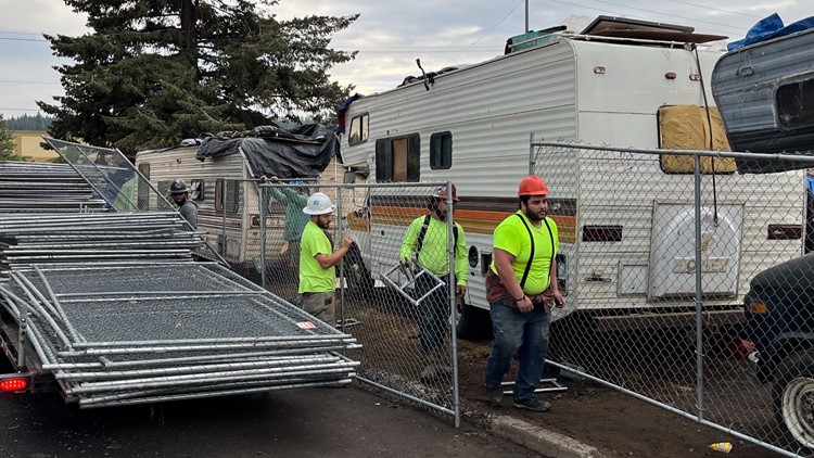 WSDOT begins putting up fence at Spokane homeless camp near I-90
