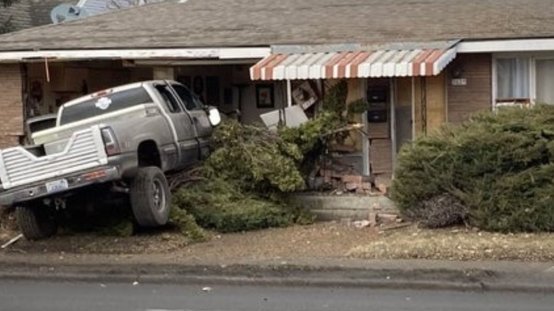 Truck driver dead after crashing into home on Mission Ave. | krem.com