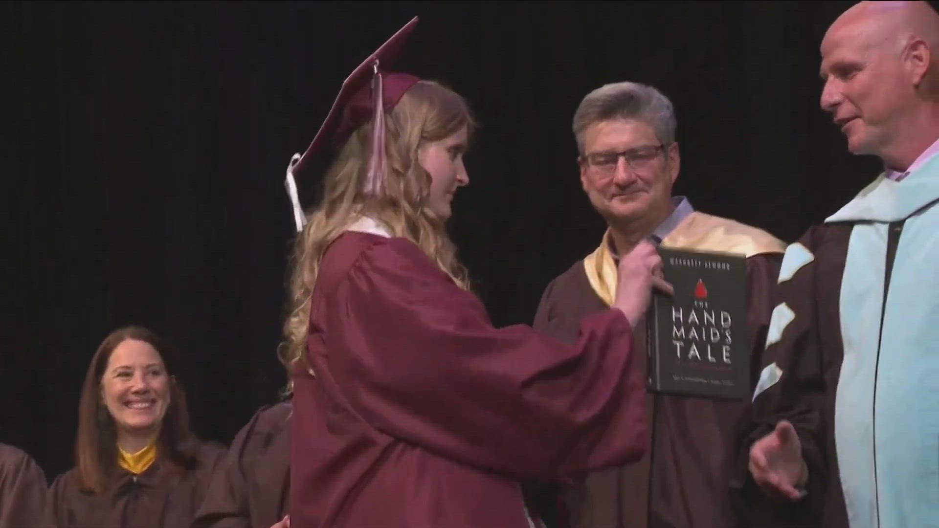 During graduation at the Idaho Fine Arts Academy, a student tried handing a copy of "The Handmaid's Tale" to the superintendent.